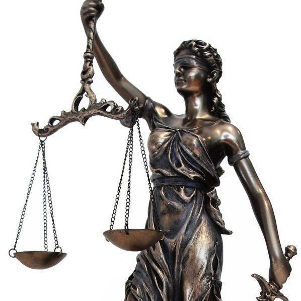 A statue of lady justice holding the scales.